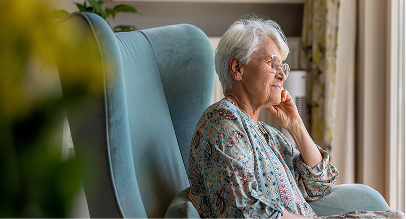 elderly woman sitting on a couch