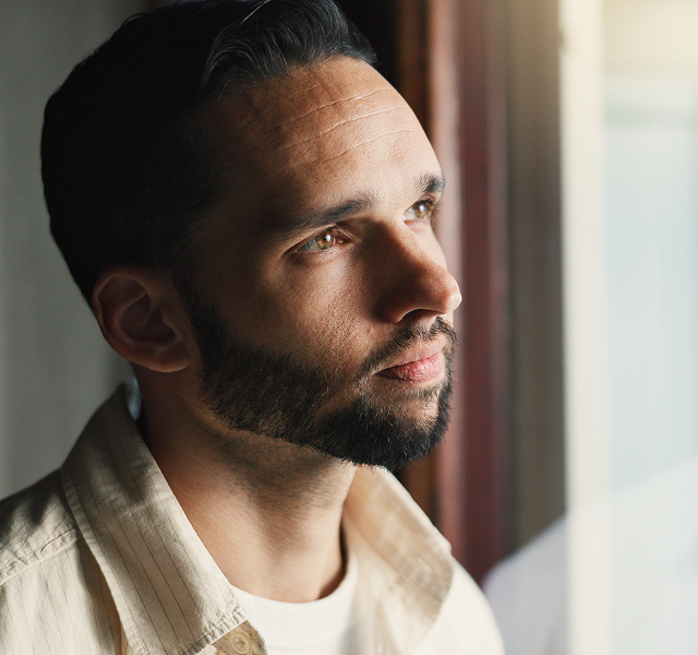close-up of a man in quiet reflection