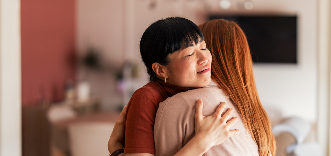 women hugging each other